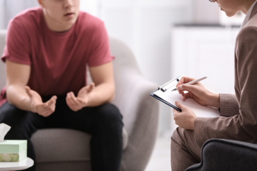 Psychotherapist,Working,With,Young,Man,In,Office,,Closeup